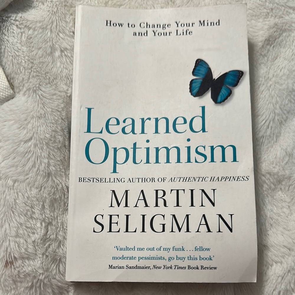 Learned Optimism Book with Blue Butterfly
